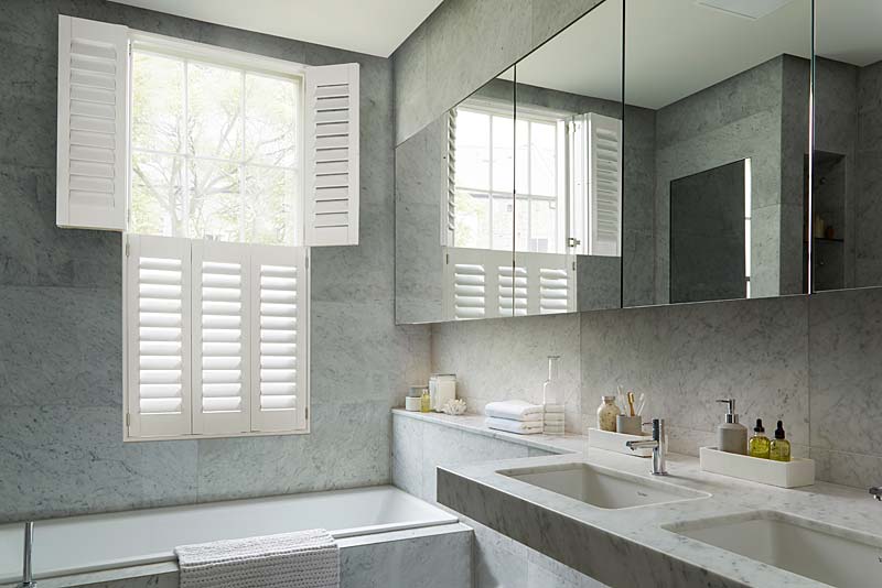tier wooden shutters fitted in bathroom